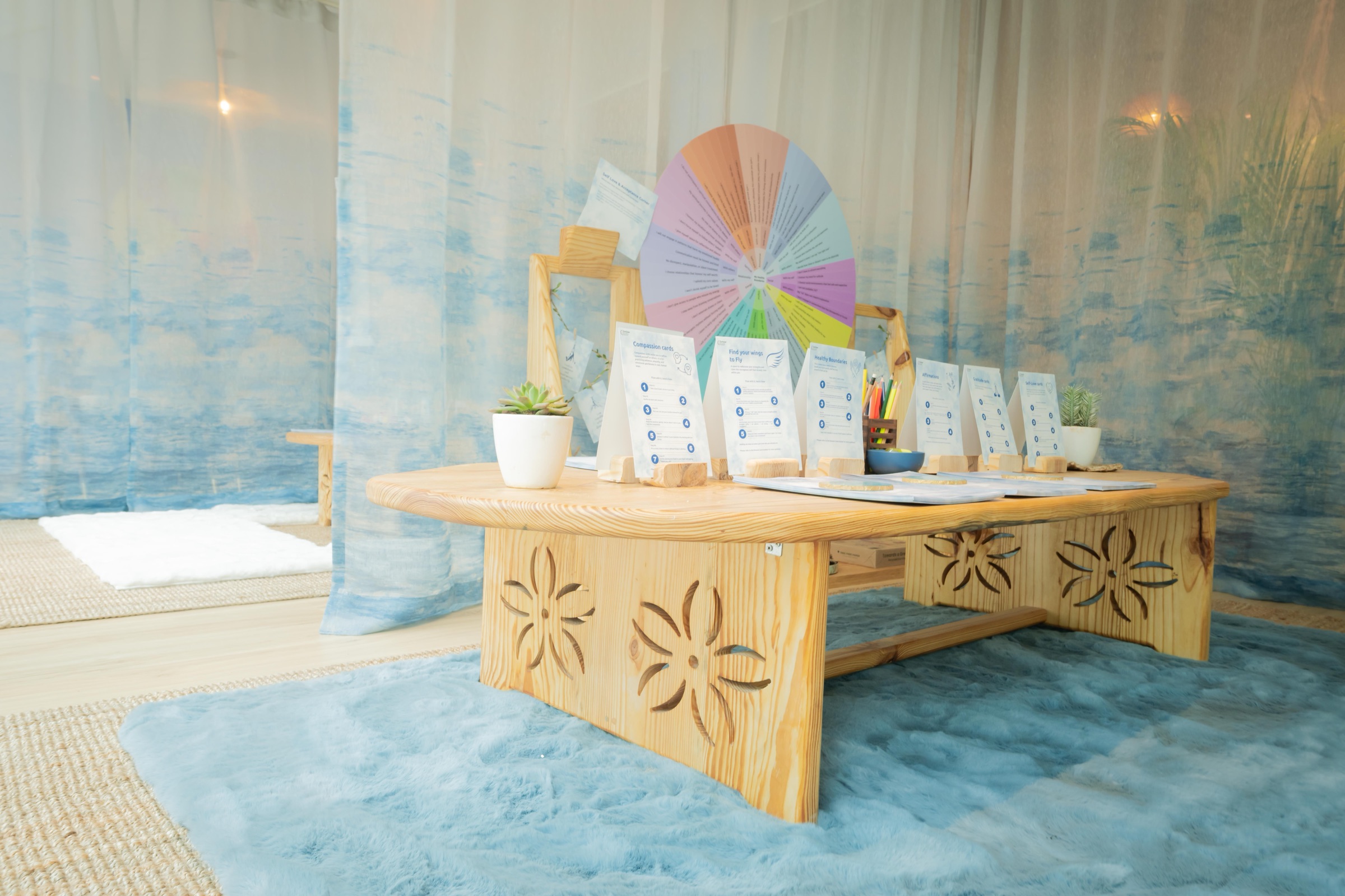 The working table: the emotion wheel and the card decks laid out for anyone to pick up